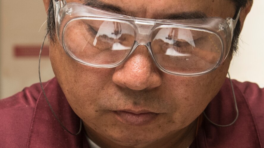 Yutaka Kashiwazaki, a 35th Force Support Squadron woodshop master laborer, saws out a detailed piece in the woodshop at Misawa Air Base, Japan, Aug. 1, 2017. Kashiwazaki worked at Misawa’s woodshop for 18 years, making various plaques, gifts and lumber pieces for customers. The woodshop is used for recreational purposes enabling service members a way to relieve stress through a creative outlet. (U.S. Air Force photo by Airman 1st Class Sadie Colbert)