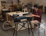 Yutaka Kashiwazaki, a 35th Force Support Squadron woodshop master laborer, uses a table saw to carve a detail piece in the woodshop at Misawa Air Base, Japan, Aug. 1, 2017. In order for personnel to have access to the shop’s tools, they must take a safety class, teaching individuals about each tool and how to properly use them. Airmen build their resiliency through building woodcrafts, which powers their ability to perform all tasks fluidly at work. (U.S. Air Force photo by Airman 1st Class Sadie Colbert)