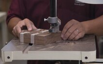 Yutaka Kashiwazaki, a 35th Force Support Squadron woodshop master laborer, uses a table saw to carve out an Air Force rank insignia in the woodshop at Misawa Air Base, Japan, Aug. 1, 2017. Kashiwazaki said adding details and creating new designs is his favorite part of woodwork. (U.S. Air Force photo by Airman 1st Class Sadie Colbert)