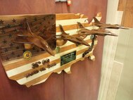 A plaque hangs on a wall in the woodshop at Misawa Air Base, Japan, Aug. 3, 2017. Yutaka Kashiwazaki, a 35th Force Support Squadron woodshop master laborer, takes his skills and passes them down to many service members who use the shop as a creative way to destress. (Courtesy Photo)