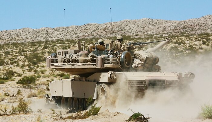 A U.S. Marine Corps M1A1 Abrams battle tank with 1st Tank Battalion, Marine Air Ground Task Force-8 (MAGTF-8) maneuvers to the next objective while conducting a Tank Mechanized Assault Course (TMAC) during Integrated Training Exercise (ITX) 5-17 at Marine Corps Air Ground Combat Center, Twentynine Palms, Calif., July 28, 2017. The purpose of ITX is to create a challenging, realistic training environment that produces combat-ready forces capable of operating as an integrated MAGTF. (U.S. Marine Corps Photo by Sgt. Kassie L. McDole)