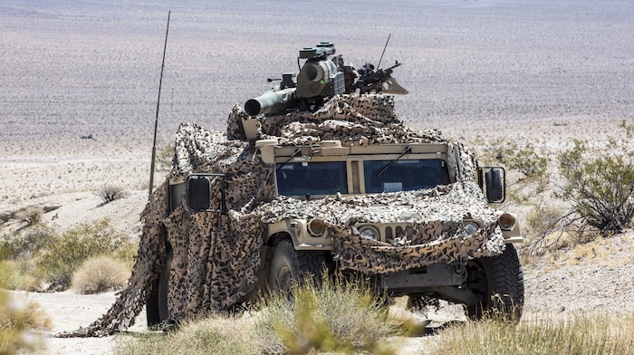 U.S. Marines with Combined Anti-Armor Team (CAAT), 1st Battalion, 1st Marine Regiment, Marine Air Ground Task Force-8 (MAGTF-8) maneuver to the next objective for a Tank Mechanized Assault Course (TMAC) during Integrated Training Exercise (ITX) 5-17 at Marine Corps Air Ground Combat Center, Twentynine Palms, Calif., July 28, 2017. The purpose of ITX is to create a challenging, realistic training environment that produces combat-ready forces capable of operating as an integrated MAGTF. (U.S. Marine Corps Photo by Sgt. Kassie L. McDole)