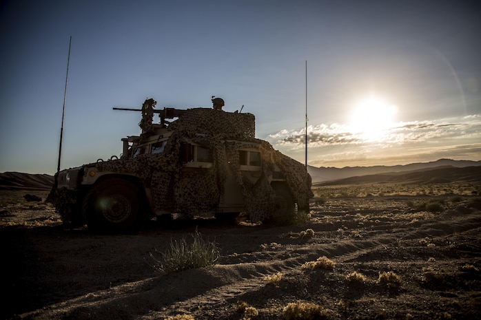 U.S. Marine Corps Lance Cpl. John D. Gruter, a machine gunner with Combined Anti-Armor Team (CAAT), 1st Battalion, 1st Marine Regiment, Marine Air Ground Task Force-8 (MAGTF-8) provides security in the turret of a HUMVEE before a Tank Mechanized Assault Course (TMAC) during Integrated Training Exercise (ITX) 5-17 at Marine Corps Air Ground Combat Center, Twentynine Palms, Calif., July 28, 2017. The purpose of ITX is to create a challenging, realistic training environment that produces combat-ready forces capable of operating as an integrated MAGTF. (U.S. Marine Corps Photo by Sgt. Kassie L. McDole)