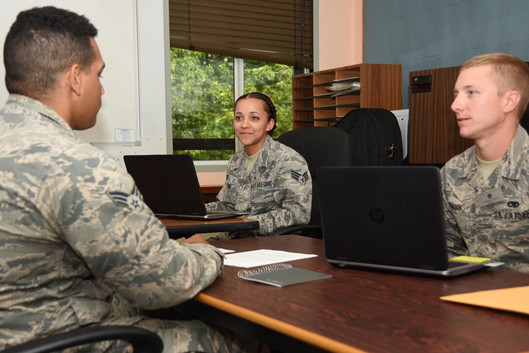 A 48th Fighter Wing senior airman, left, participated in an interview at Royal Air Force Lakenheath, England, July 31. The interviewers travelled to 25 bases all over the world to collect information in an effort to revitalize U.S. Air Force squadrons. (U.S. Air Force photo/Airman 1st Class Abby L. Finkel)