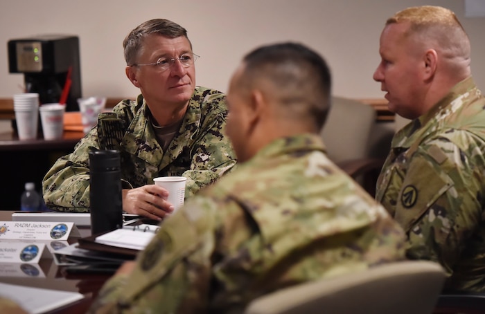 Rear Adm. Lawrence Jackson, left, U.S. Transportation Command Strategy, Capabilities, Policy and Logistics Directorate outgoing director, talks to soldiers from the 841st Transportation Battalion during a mission briefing Aug. 1 at the Joint Base Charleston - Weapons Station as part of an orientation visit. Jackson and Rear Adm. Peter Clarke, USTRANSCOM Strategy, Capabilities, Policy and Logistics Directorate incoming director, received a 437th Airlift Wing mission briefing, observed demonstrations and toured a C-17 Globemaster III and the 437th Aerial Port Squadron during the visit. USTRANSCOM is a unified, functional combatant command which provides support to the eight other U.S. combatant commands, the military services, defense agencies and other government organizations by providing full-spectrum global mobility solutions and related enabling capabilities for supported customers’ requirements in peace and war.