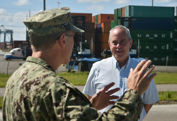 Christopher Zahner, right, 841st Transportation Battalion traffic manager, talks to Rear Adm. Lawrence Jackson, left, U.S. Transportation Command Strategy, Capabilities, Policy and Logistics Directorate outgoing director, Aug. 1 during a rail head tour at the Joint Base Charleston - Weapons Station as part of an orientation visit. Jackson and Rear Adm. Peter Clarke, USTRANSCOM Strategy, Capabilities, Policy and Logistics Directorate incoming director, received a 437th Airlift Wing and 841st Transportation Battalion mission briefing, observed demonstrations and toured a C-17 Globemaster III and the 437th Aerial Port Squadron during the visit. USTRANSCOM is a unified, functional combatant command which provides support to the eight other U.S. combatant commands, the military services, defense agencies and other government organizations by providing full-spectrum global mobility solutions and related enabling capabilities for supported customers’ requirements in peace and war.