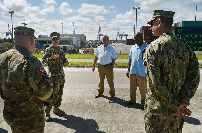 Rear Adm. Lawrence Jackson, center left, U.S. Transportation Command Strategy, Capabilities, Policy and Logistics Directorate outgoing director and Rear Adm. Peter Clarke, right, USTRANSCOM Strategy, Capabilities, Policy and Logistics Directorate incoming director, provide feedback Aug. 1 for members of the 841st Transportation Battalion during a rail head tour at the Joint Base Charleston – Weapons Station as part of an orientation visit. Jackson and Clarke received a 437th Airlift Wing mission briefing, observed demonstrations and toured a C-17 Globemaster III and the 437th Aerial Port Squadron during the visit. USTRANSCOM is a unified, functional combatant command which provides support to the eight other U.S. combatant commands, the military services, defense agencies and other government organizations by providing full-spectrum global mobility solutions and related enabling capabilities for supported customers’ requirements in peace and war.