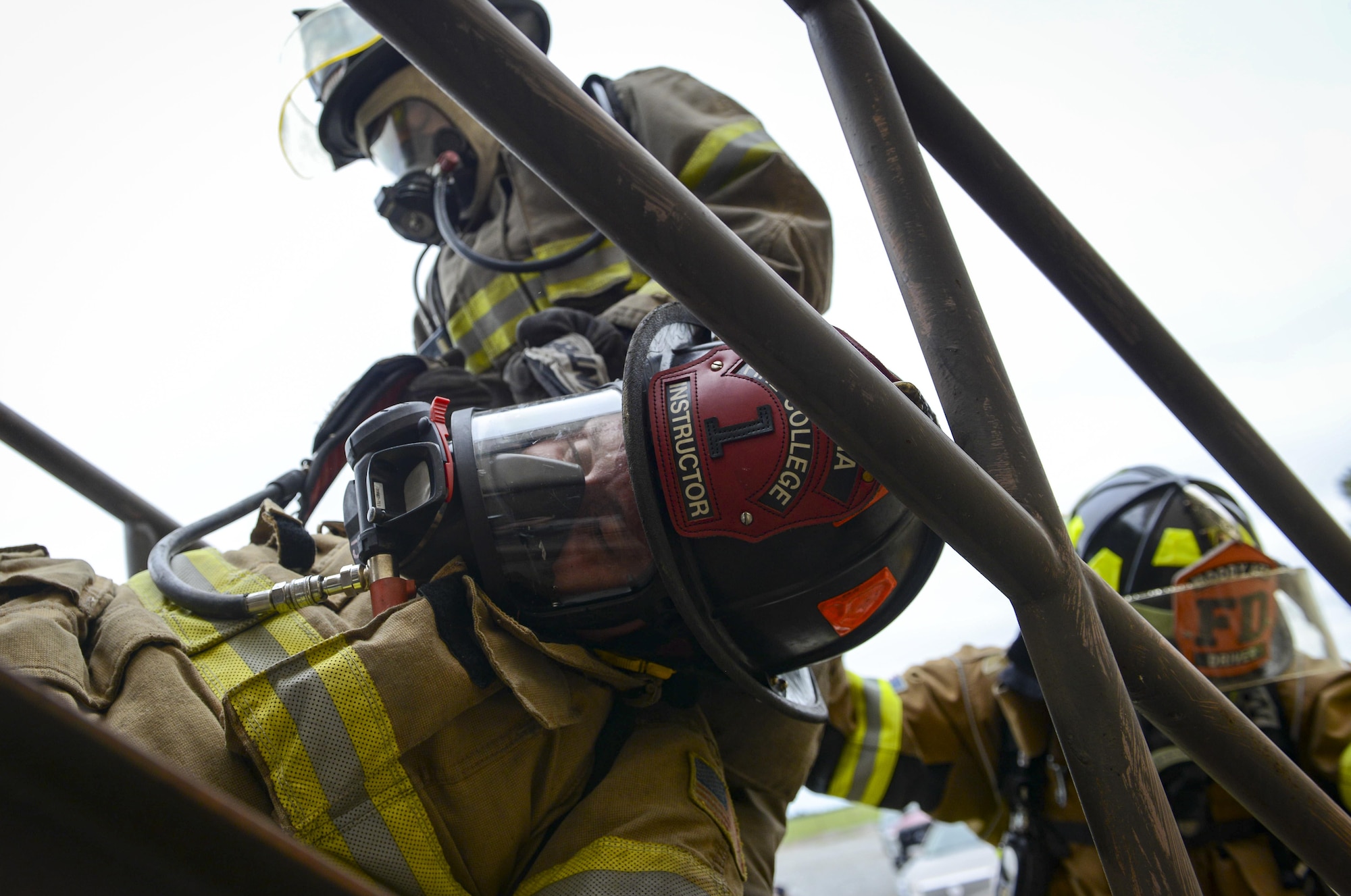 Firefighters from the 23d Civil Engineer Squadron carry a simulated victim down a staircase during rapid intervention fire training, Aug. 3, 2017, at Moody Air Force Base, Ga. Rapid intervention refers to the rescue of downed firefighters when they find themselves in trouble. During the course, Moody firefighters, as well as a Lowndes County firefighter, learned how to perform self-rescue, team rescue, and basic skills such as CPR and various carries in order to transport victims. (U.S. Air Force photo by Airman 1st Class Lauren M. Sprunk)