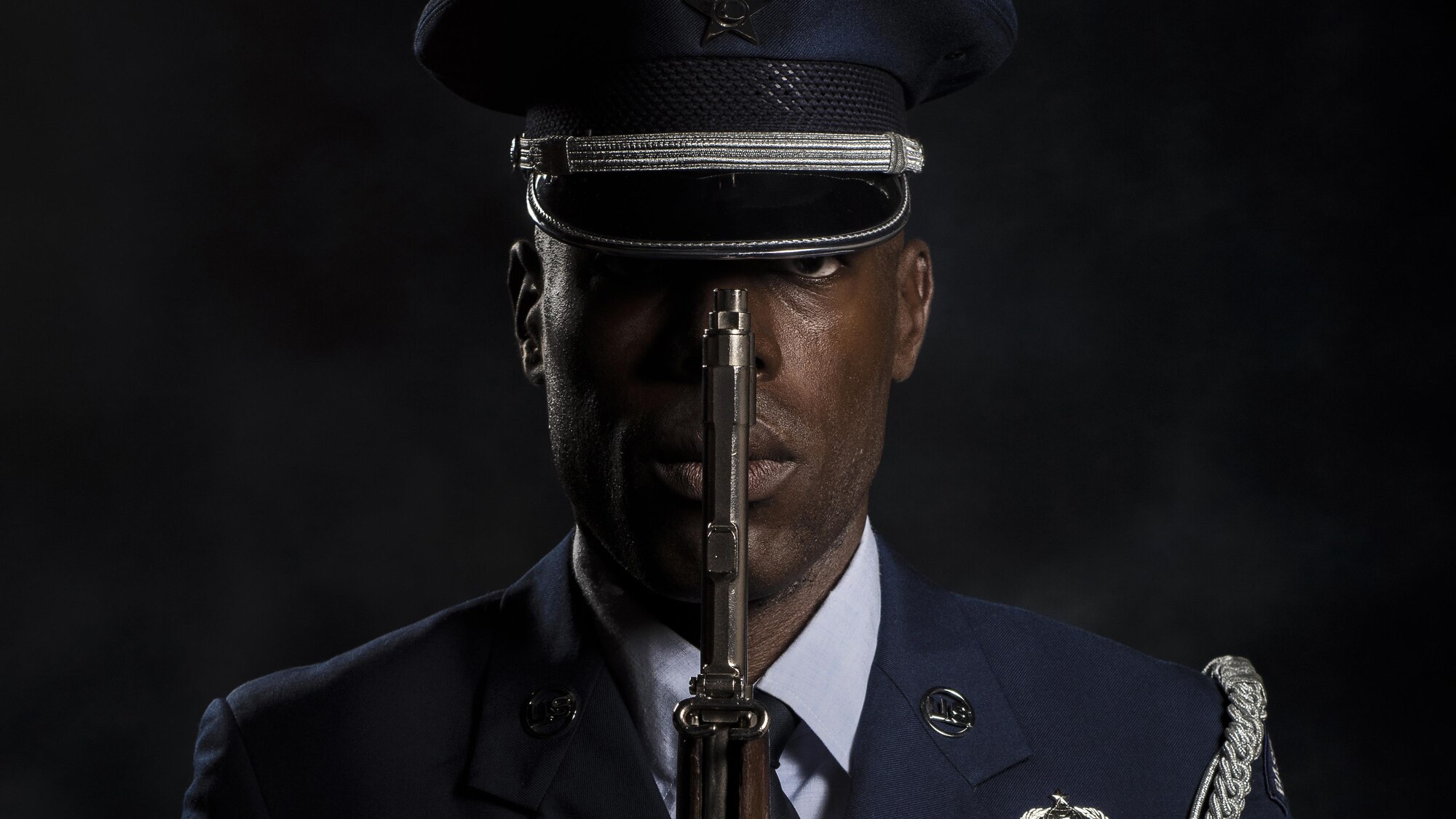 Tech. Sgt. Martin Wallace, 31st Fighter Wing Honor Guard lead instructor, represents his team of honor guard members as a photo is made of him on July 13, 2017, at Aviano Air Base, Italy. Wallace currently leads more than 30 Airmen who are working to become fully qualified honor guardsmen. (U.S. Air Force photo/Senior Airman Cory W. Bush)