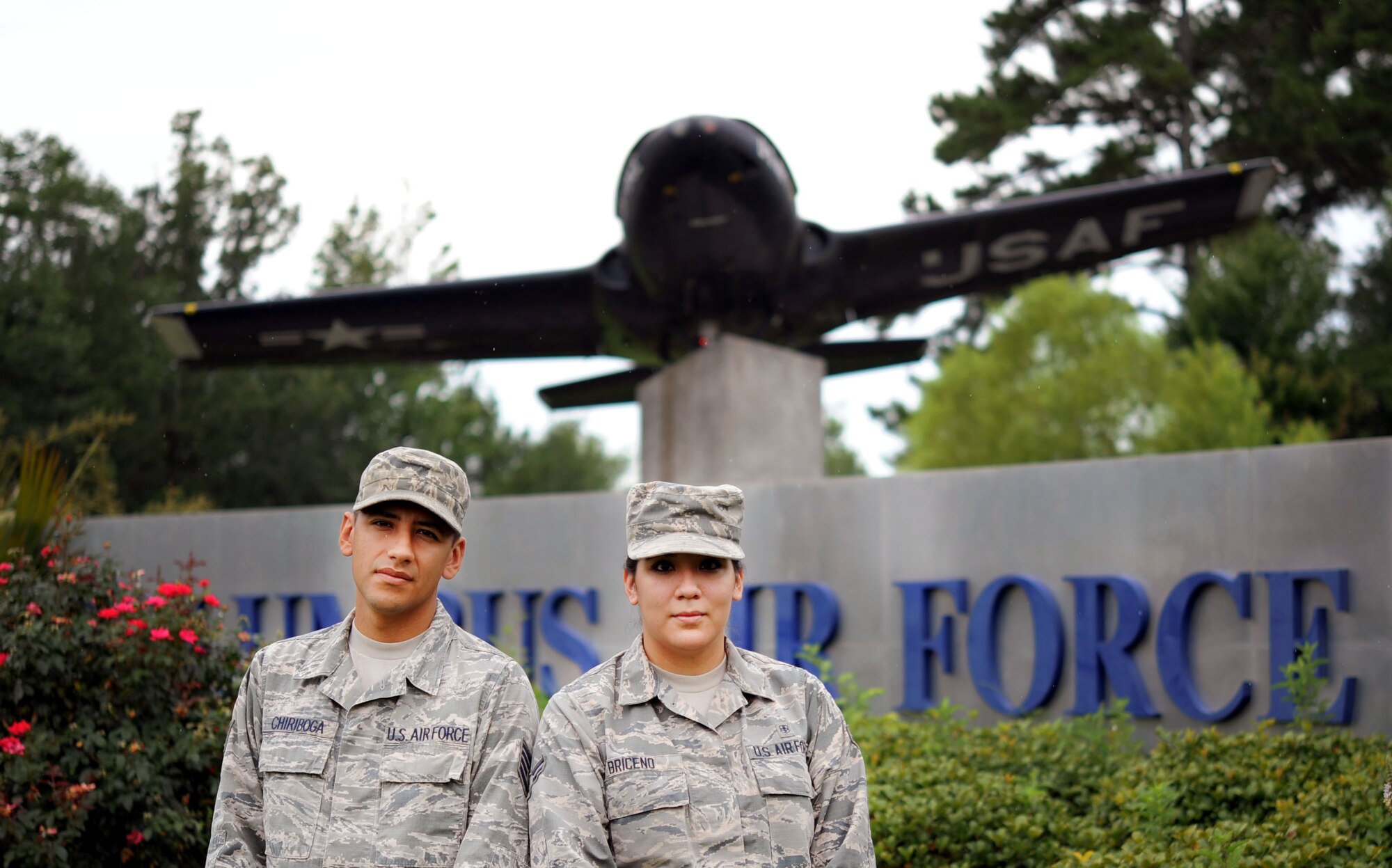 Staff Sgt. Luis Chiriboga, a 14th Civil Engineer Squadron engineering technician, and his wife, Airman 1st Class Estefania Briceno Ron, a personnel and administration technician assigned to the 14th Medical Support Squadron, stand at the entrance of Columbus Air Force Base, Mississippi. Chiriboga and Briceno Ron are both natives of Ecuador and received their U.S. citizenship after joining the Air Force. (U.S. Air Force photo by Staff Sgt. Chris Gross)