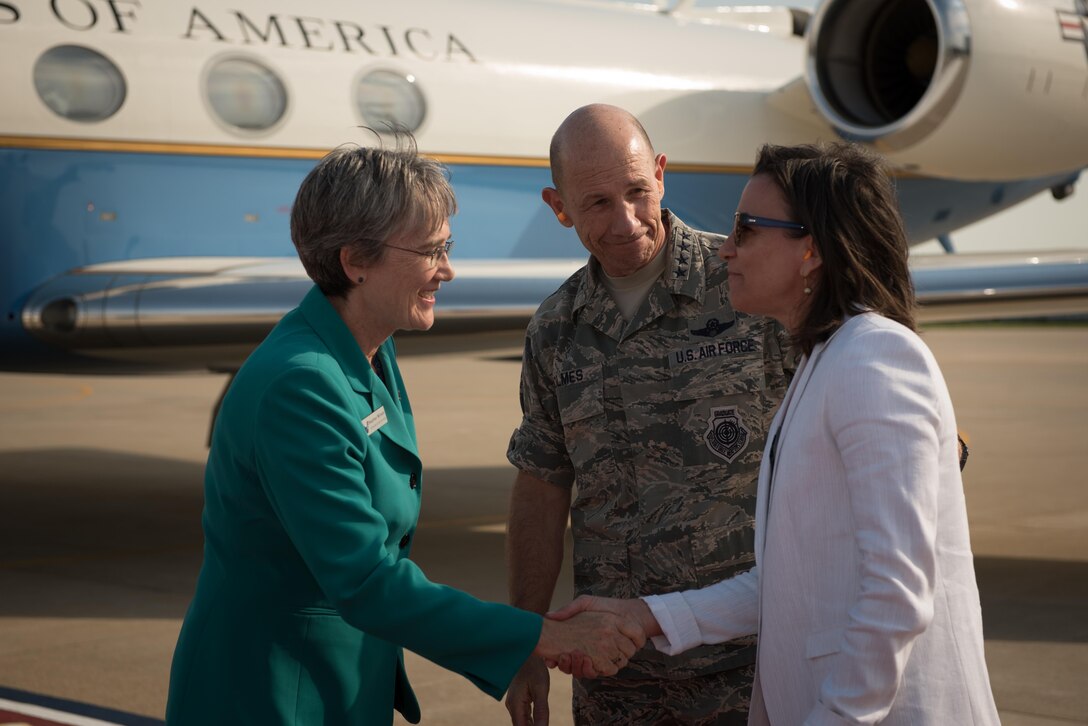Photo of Air Force Secretary Heather Wilson shaking hands with commander of Air Combat Command Gen. Mike Holmes' wife Sara during her visit to Joint Base Langley-Eustis, Virginia.
