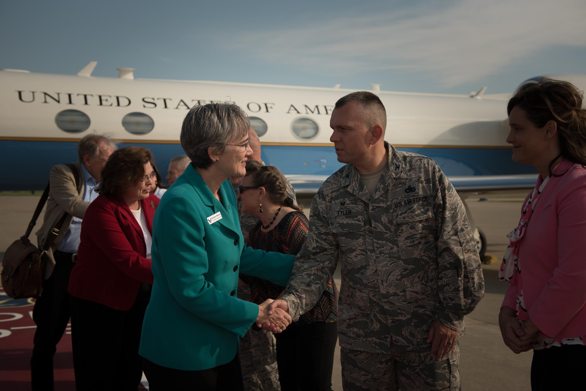 Photo of Air Force Secretary Heather Wilson shaking hands with Col. Sean Tyler, 633rd Air Base Wing commander during her visit to Joint Base Langley-Eustis, Virginia.