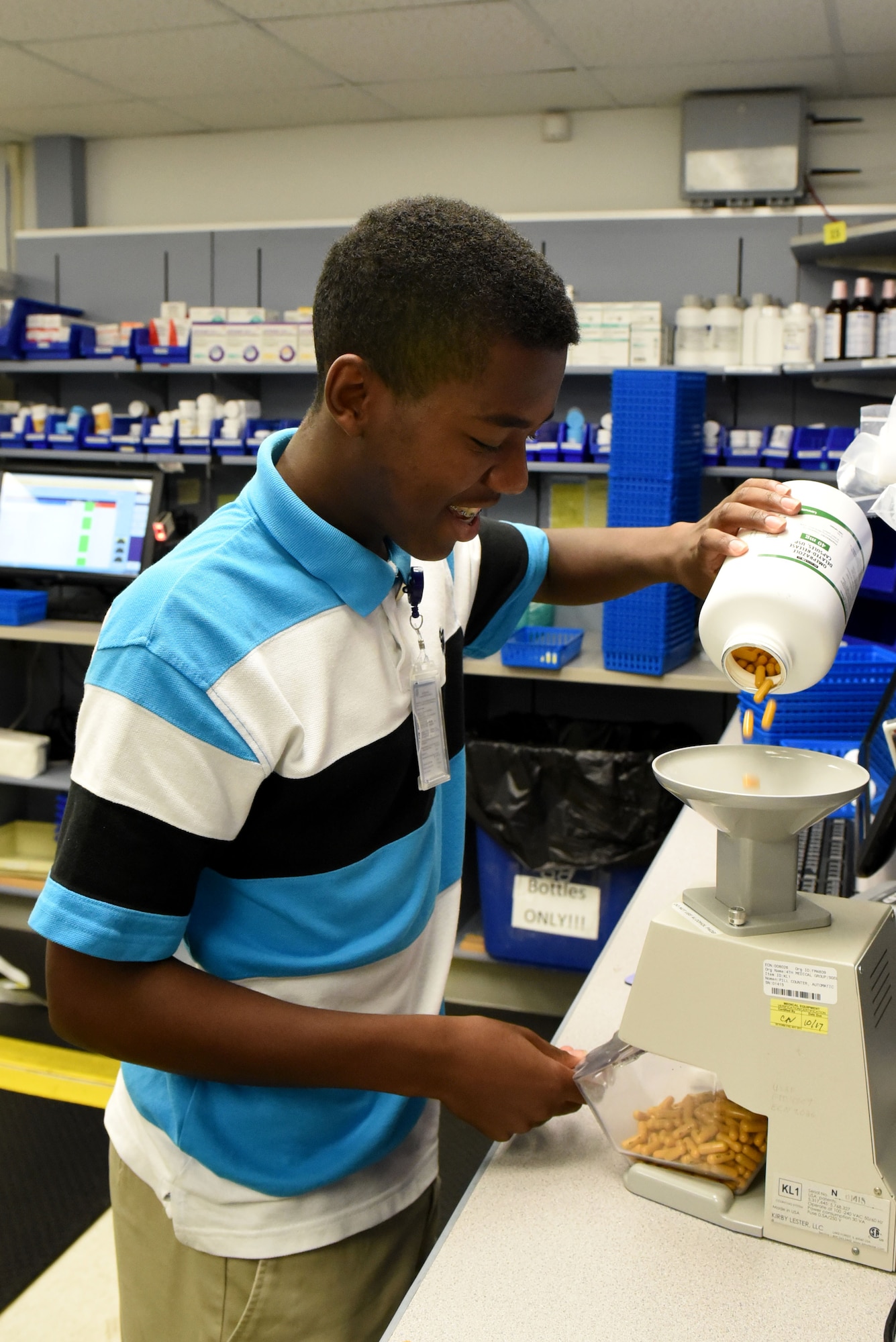 Jaylon Wallace, Goldsboro Summer Youth Employment Initiative Program participant, prepares a pre-pack of medication during his internship, July 19, 2017, at the 4th Medical Group pharmacy at Seymour Johnson Air Force Base, North Carolina.