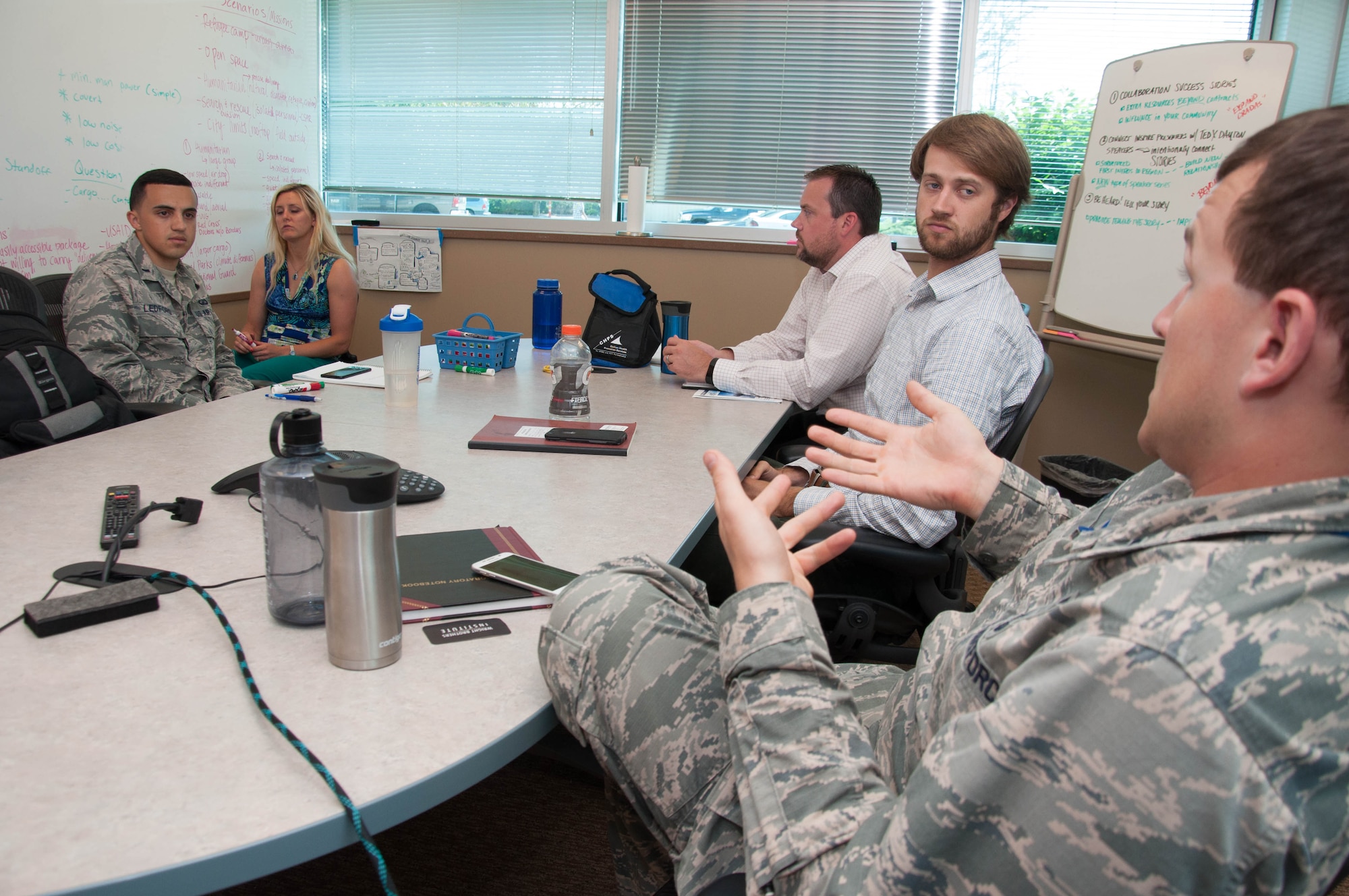 DAYTON, Ohio – 1st Lt. Connor Wiese (right), a development engineer with Team Wright-Patt, proposes an idea to his team during a brainstorming session Aug. 2 as part of the Air Force Research Laboratory Commander’s Challenge 2017.  The challenge brings Airmen together from a wide-range of specialties to tackle a real-world problem with a maximum budget of $50,000 and six months to develop a working demonstration. (U.S. Air Force photo/John Harrington)