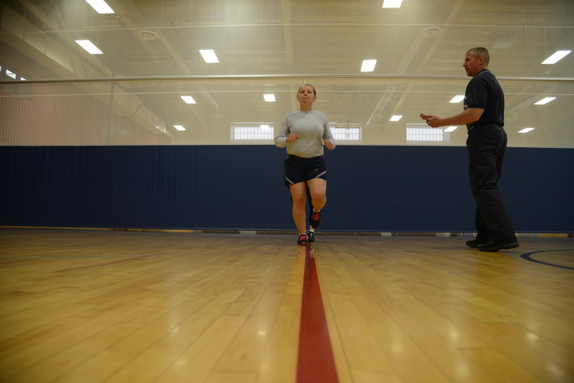 Staff Sgt. Adriana Bitker, 341st Medical Operations Support Squadron physical therapy technician, demonstrates a forward leaning running technique during a running clinic Aug. 1, 2017, at Malmstrom Air Force Base, Mont.