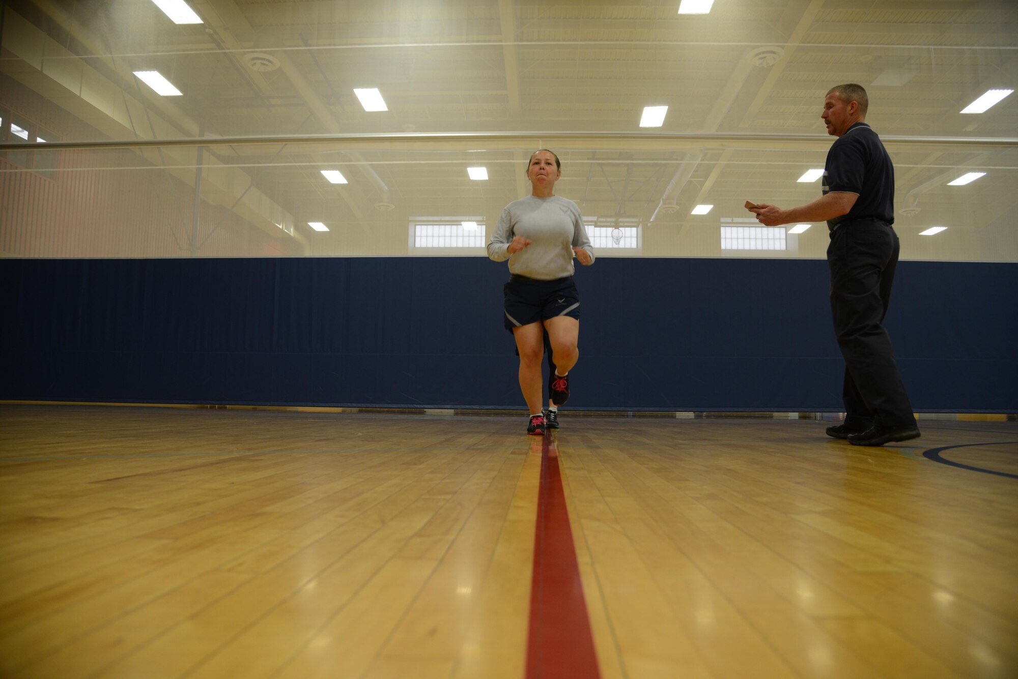 Staff Sgt. Adriana Bitker, 341st Medical Operations Support Squadron physical therapy technician, demonstrates a forward leaning running technique during a running clinic Aug. 1, 2017, at Malmstrom Air Force Base, Mont.