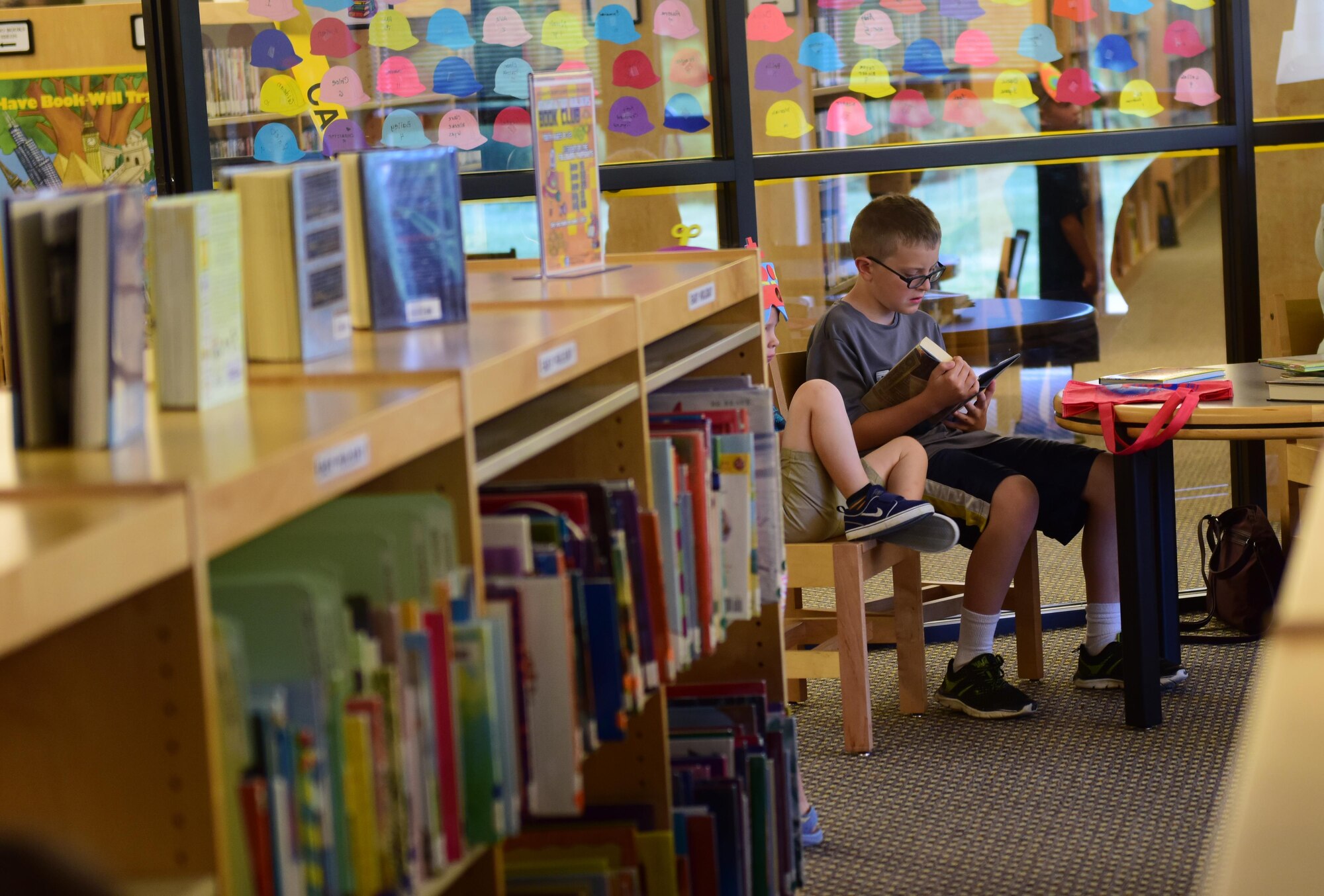 Members of Team Whiteman participate in the library's summer reading program at Whiteman Air Force Base, Mo., July 12, 2017. Around 300 children of all ages are involved in the three-month program. The program included self-paced reading, crafts, scavenger hunts and other fun activities.