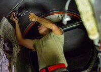 U.S. Air Force Airman 1st Class Christopher Michael, an aircraft propulsion system apprentice with the 509th Aircraft Maintenance Squadron, puts on a fire shroud prior to an engine being installed on a B-2 Spirit at Whiteman Air Force Base, Mo., July 27, 2017. Aircraft propulsion system technicians dedicate hours to ensure all parts of the engine are working at optimal condition.