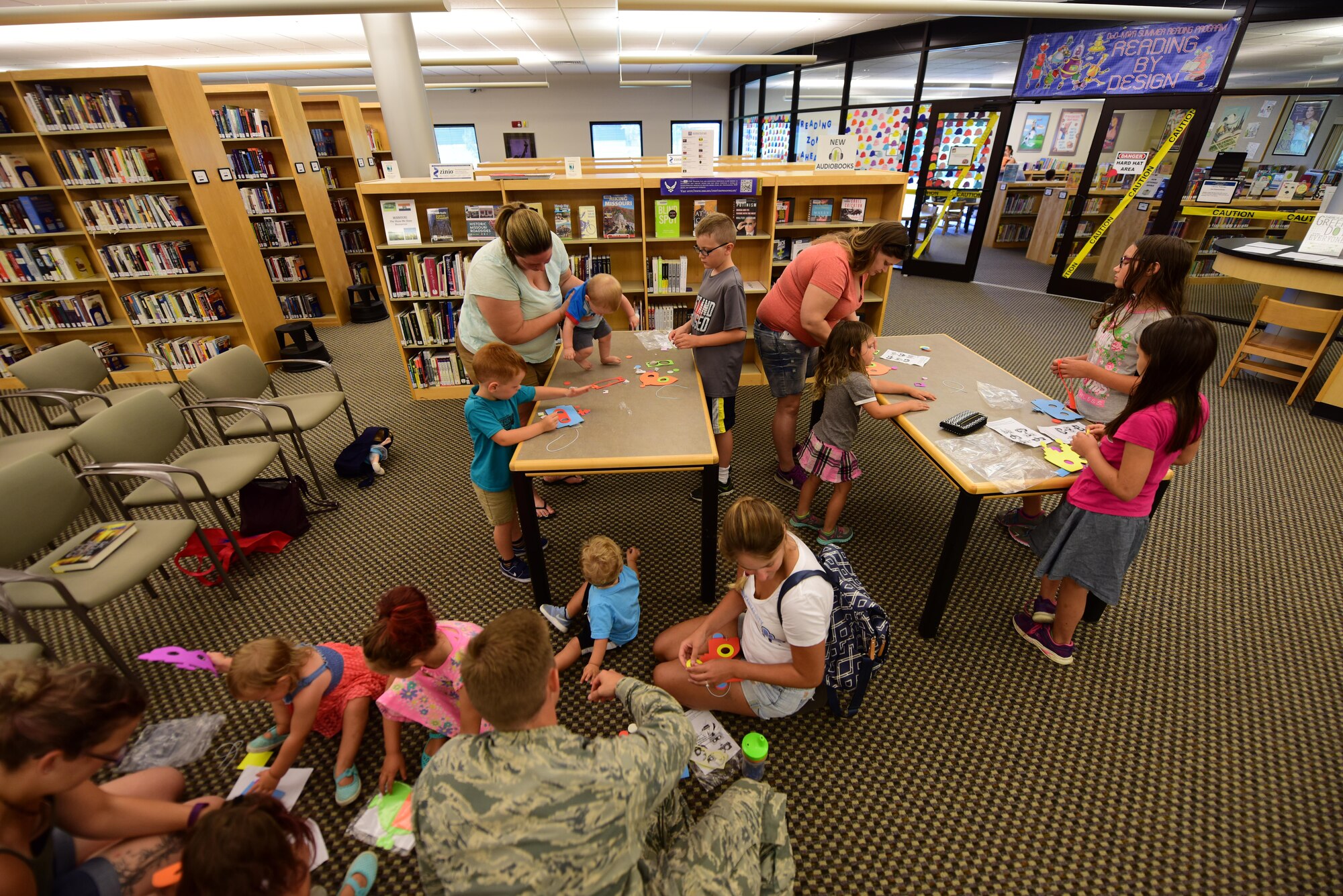 Members of Team Whiteman participate in the library's summer reading program at Whiteman Air Force Base, Mo., July 12, 2017. Around 300 children of all ages are involved in the three-month program. The program included self-paced reading, crafts, scavenger hunts and other fun activities.