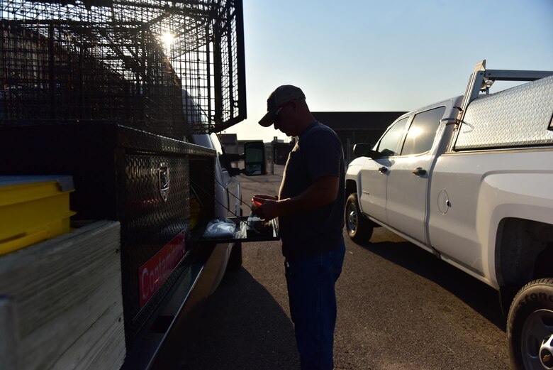 Jim Ivie, a pest control specialist assigned to the 509th Civil Engineer Squadron, prepares
a single-door trap for placement at Whiteman Air Force Base, Mo., Aug. 2, 2017.
The traps are designed to close once an animal enters to eat the bait on the opposite
end of the trap.