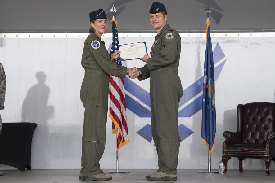 Col. Jennifer Short, 23d Wing commander, presents the Legion of Merit award to Col. Timothy Sumja, 23d Fighter Group outgoing commander, during a change of command ceremony, at Moody Air Force Base, Aug. 4, 2017. During his command, Sumja directed flying and support operations for the largest A-10C Thunderbolt II operational fighter group. (U.S. Air Force photo by Staff Sgt. Olivia Dominique)