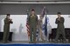 Col. Jennifer Short, 23d Wing commander, and Col. Timothy Sumja, 23d Fighter Group outgoing commander, give a round of applause for Col. Michael Curley, 23d FG incoming commander, during a change of command ceremony at Moody Air Force Base, Ga., Aug. 4, 2017. Curley was the Chief of the Training, Exercises, and Readiness Division at Headquarters U.S. Air Forces in Europe. (U.S. Air Force photo by Staff Sgt. Olivia Dominique)