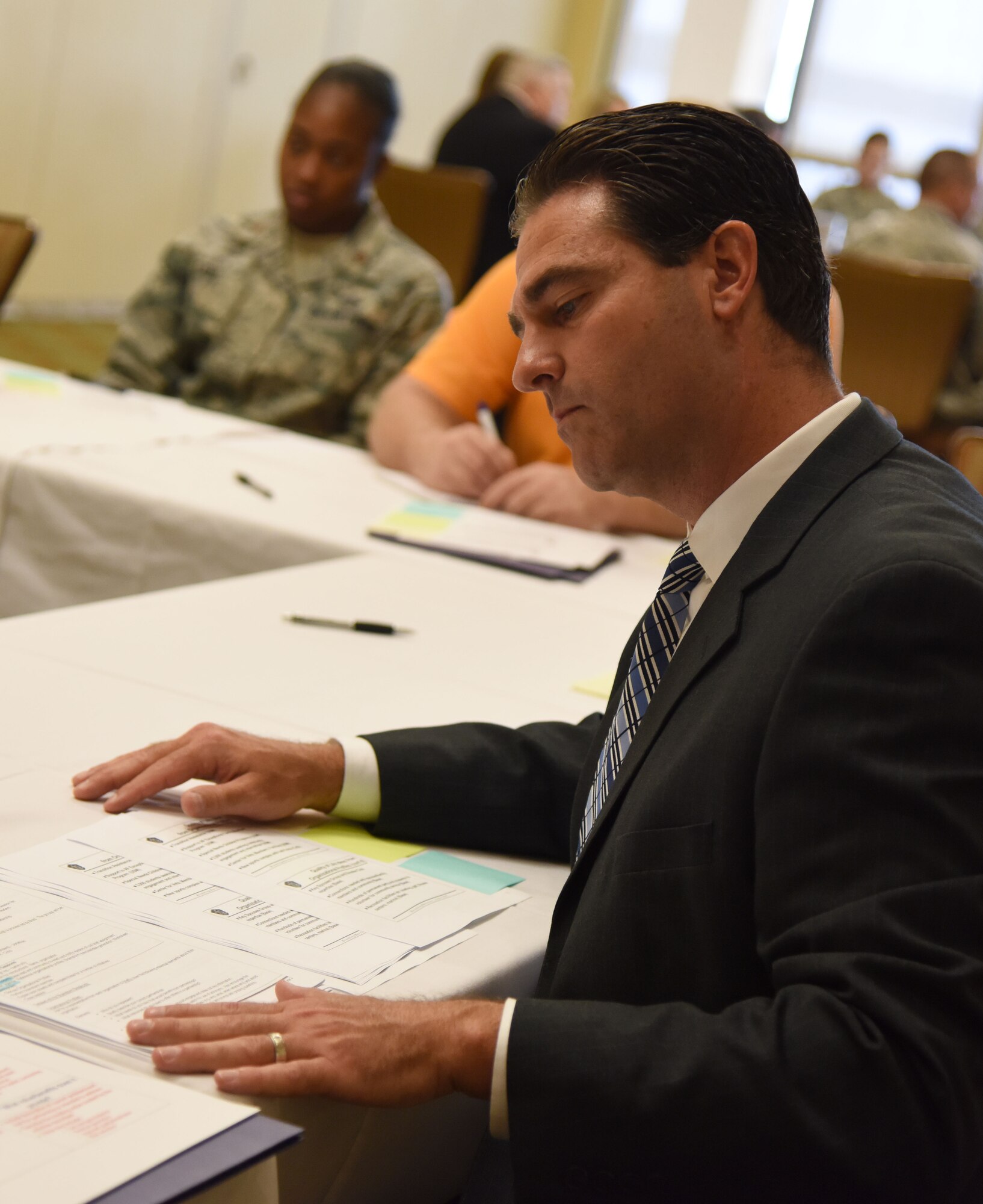 Chris McNees, Aerostar SES, LLC., program manager, leads the quality of life/community benefit group discussion during the Air Force Community Partnership Program Ideas Workshop at the Bay Breeze Event Center July 27, 2017, on Keesler Air Force Base, Miss. The program administrators are working to leverage military and local community capabilities and resources to achieve mutual value and benefit in support of the Air Force and its business partners. (U.S. Air Force photo by Kemberly Groue)