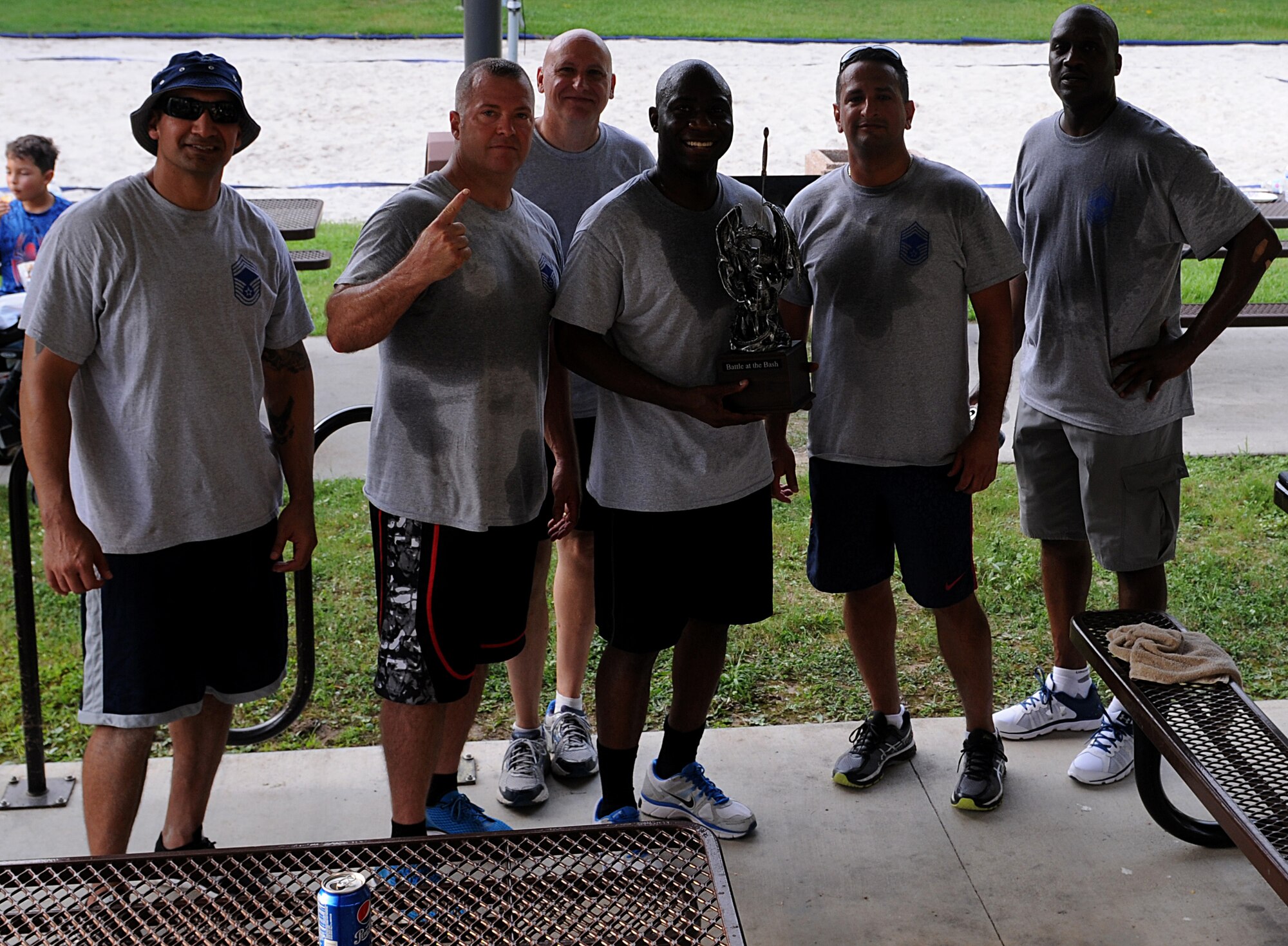 Keesler chief master sergeants pose for a photo during the 2017 Dorm Bash at the Biloxi Hall courtyard August 1, 2017, on Keesler Air Force Base, Miss. The Dorm Bash was sponsored by the Keesler Chiefs Group to provide an opportunity for Keesler dorm residents to spend time together in fellowship. The chief master sergeants took home the Battle of the Bash Dragon award. (U.S. Air Force photo by Airman 1st Class Suzanna Plotnikov)