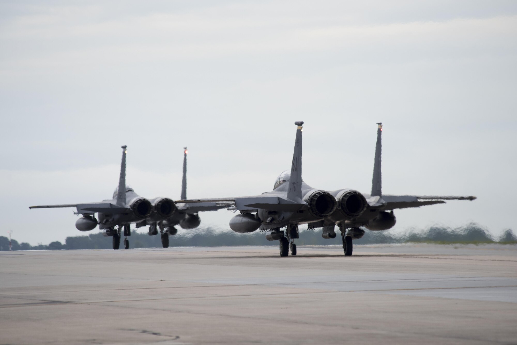 Two F-15E Strike Eagles taxi down the runway, Aug. 4, 2017, at Seymour Johnson Air Force Base, North Carolina. Approximately 12 jets from the 336th Fighter Squadron left to participate in exercise Combat Hammer at Hill Air Force Base, Utah. (U.S. Air Force photo by Airman 1st Class Shawna L. Keyes)