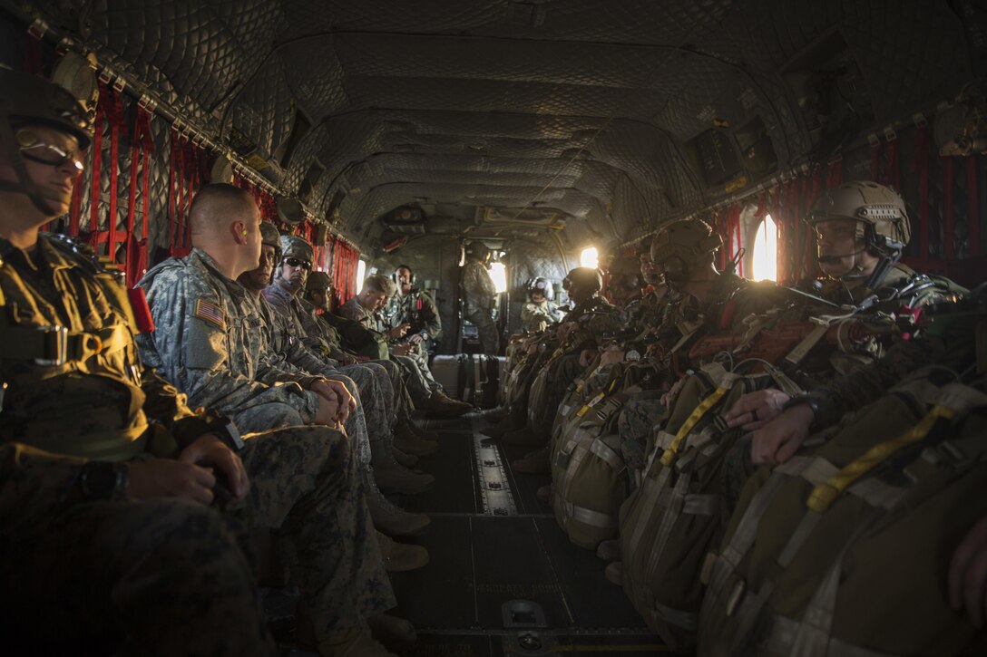 U.S. Marines with Echo Company, 4th Reconnaissance Battalion, 4th Marine Division, Marine Forces Reserve, and U.S. Army soldiers with 3rd Battalion, 238th General Support Aviation Regiment, standby to execute high altitude, high opening (HAHO) jump operations