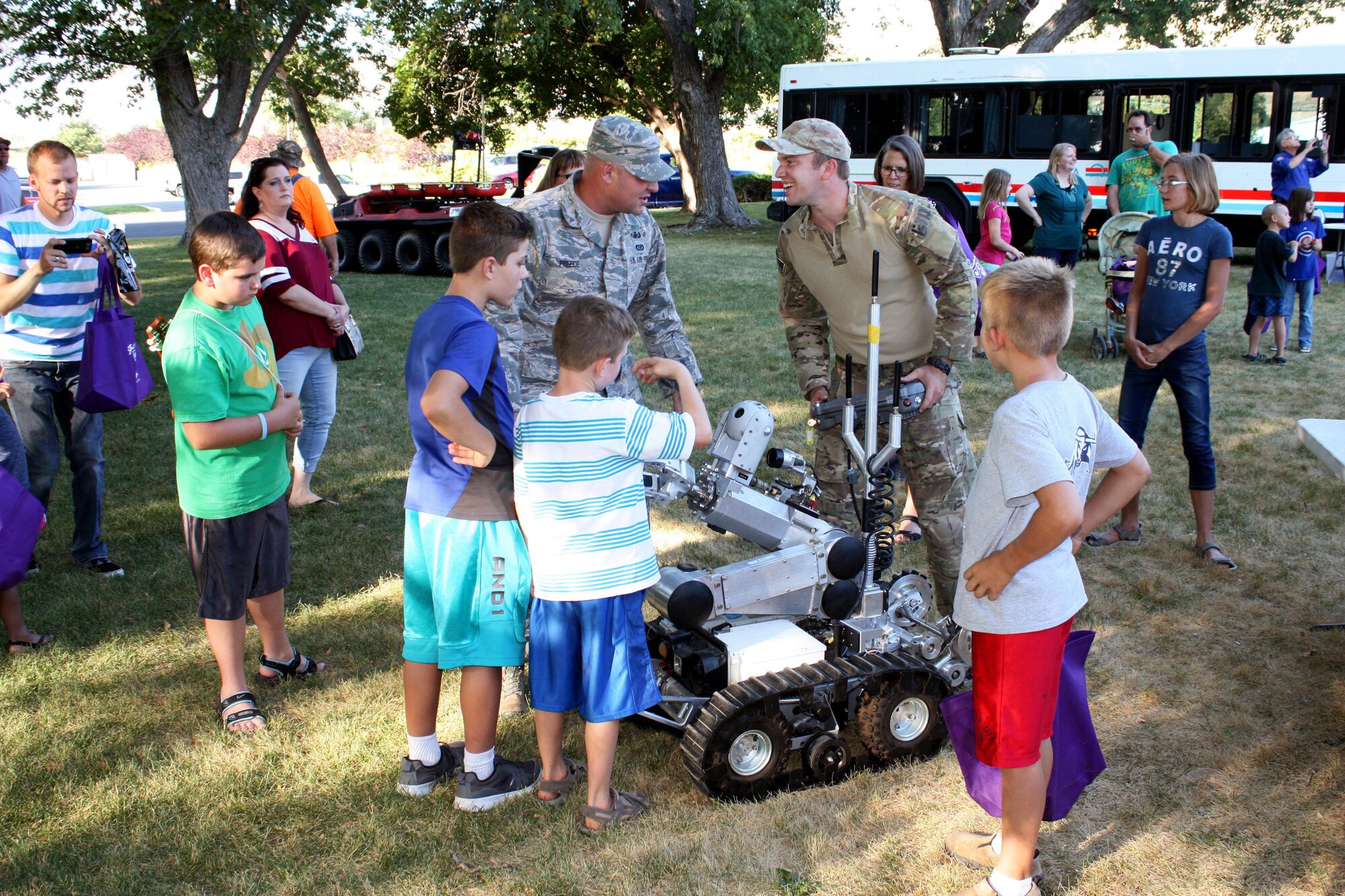 Explosive ordnance disposal experts demonstrate a robot used to safely find and detonate unexploded bombs