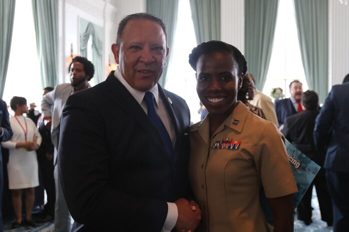 Captain Charlyne Delus, a Marine Corps officer from Miami, Fl., shakes hands with Mark H. Morial, the National Urban League president and chief executive officer, at the Chairman’s Leadership Reception at the Marriott St. Louis Grand Hotel in St. Louis, Mo., on July 27, 2016. The theme of this year’s National Urban League National Conference was “Save Our Cities: Education, Jobs and Justice.” (U.S. Marine Corps photo by Sgt. Jennifer Webster/Released)