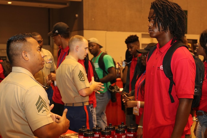 Marines with Marine Corps Recruiting Command and Recruiting Station St. Louis interact and engage with students at the College Fair during the National Urban League Youth Leadership Summit at the St. Louis Convention Center on July 29, 2017. The theme for this year’s Youth Summit was “Show Me: Turn Talk Into Action.” (U.S. Marine Corps photo by Sgt. Jennifer Webster/Released)