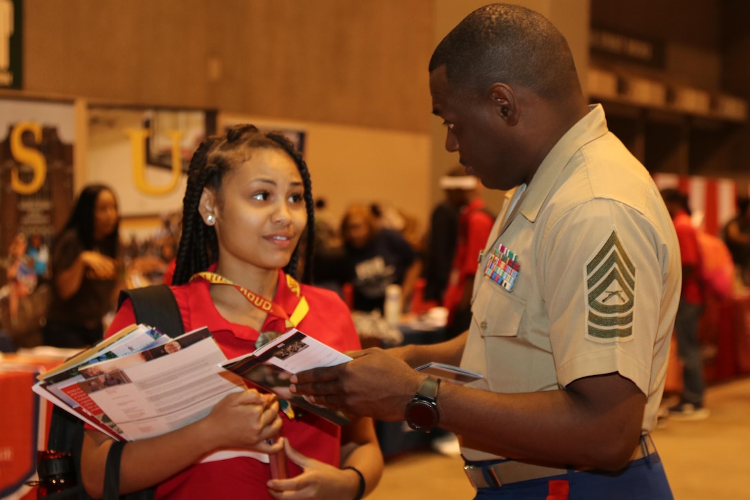 Marines with Marine Corps Recruiting Command and Recruiting Station St. Louis interact and engage with students at the College Fair during the National Urban League Youth Leadership Summit at the St. Louis Convention Center on July 29, 2017. The theme for this year’s Youth Summit was “Show Me: Turn Talk Into Action.” (U.S. Marine Corps photo by Sgt. Jennifer Webster/Released)