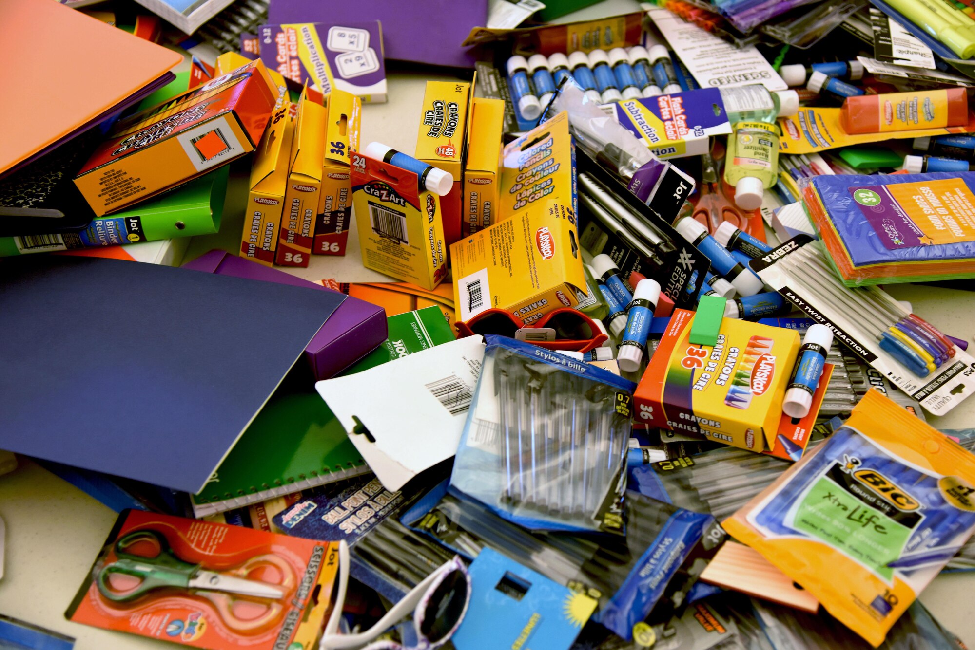 Assorted school supplies sit on display for military families in the Bay Ridge Community Center for a back-to-school event sponsored by Operation Homefront Aug. 1, 2017, on Keesler Air Force Base, Miss. More than 4,000 items and 300 backpacks were donated to 120 military families. (U.S. Air Force photo by Kemberly Groue)