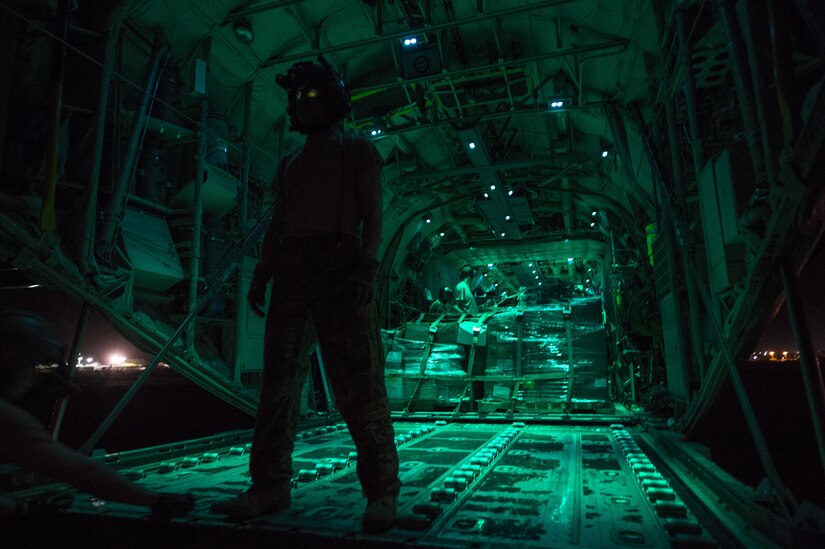 a loadmaster from the 75th Expeditionary Airlift Squadron, waits for a cargo load during a mission in Somalia in support of the Combined Joint Task Force-Horn of Africa