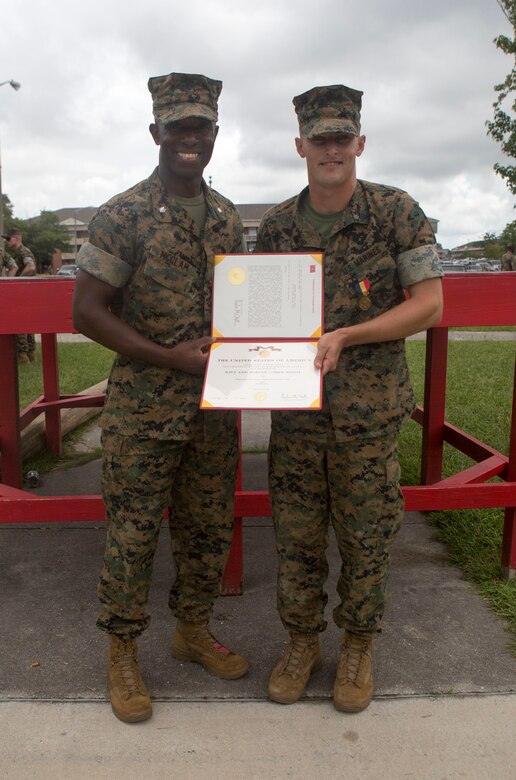 Sgt. Kevin Peach, an infantryman with 1st Battalion, 8th Marine Regiment, was awarded a Navy and Marine Corps Medal by Lt. Col. Reginald McClam, commanding officer of 1st Battalion, 8th Marine Regiment, during a battalion formation at Camp Lejeune, N.C., Aug. 8, 2017. Peach was awarded for rescuing a man from a burning vehicle on I-5 in California.