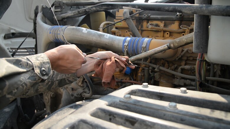 Airman 1st Class Gavin Johnson, 341st Missile Maintenance Squadron tool room technician, inspects the fluids for a truck Aug. 1, 2017, at Malmstrom Air Force Base, Mont.