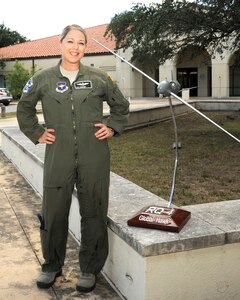 U.S. Air Force Tech. Sgt. Courtney poses
for a photo before the 558th Flying Training Squadron's Undergraduate
Remotely Piloted Aircraft Training Course graduation August 4, 2017, at
Joint Base San Antonio-Randolph, Texas. Tech. Sgt. Courtney is the
first-ever enlisted female to qualify as an RPA pilot. Name badges were
blurred due to Air Force limits on disclosure of identifying information for
RPA operators. (U.S. Air Force Illustration by Tech. Sgt. Ave I. Young)