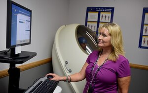 Peggy Diaz de Leon, Schriever Health Promotions Program coordinator, calibrates settings for the Bod Pod at Schriever Air Force Base, Colorado, Wednesday, Aug. 2, 2017. Previously known as the HAWC, the Health Promotions Program offers various classes and tools to help the Schriever community achieve a healthy lifestyle. (U.S. Air Force photo/Senior Airman Arielle Vasquez)