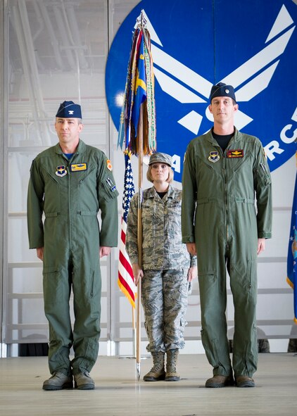 Col. James Keen, 54th Fighter Group commander, and Lt. Col. Mark Sletten, 8th Fighter Squadron commander, stand at attention during the 8th FS activation ceremony at Holloman Air Force Base, N.M. Aug. 4, 2017. The 8th FS has been reactivated six years after its last inactivation May 13, 2011. The 8th FS, with its long-standing history, will now maintain and pilot F-16 fighter jets. According to Sletten, more than 40 F-16 fighter jets are projected to be transported to Holloman, which is almost double the amount of aircraft currently stationed here. (U.S. Air Force photo by Airman 1st Class Alexis P. Docherty)