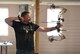 Bobby Johnson, 90th Civil Engineer Squadron storage tank manager, prepares to shoot his arrow during the annual Frontiercade archery competition at F.E. Warren Air Force Base, Wyo., Aug. 4, 2017. The archery competition was one of many that Airmen and families could participate in. (U.S. Air Force photo by Airman 1st Class Breanna Carter)