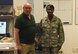 Stephen West, 90th Medical Group emergency manager, stands with Col. Cherron Galluzzo, 90th MDG commander, at F.E. Warren Air Force Base, Wyo., August 4, 2017. Galluzzo stopped by to congratulate West on his service to the medical group. (U.S. Air Force photo by Terry Higgins)