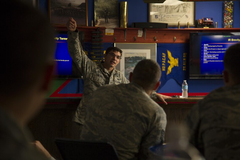 Senior Airman Jason Holmes, 25th Air Support Operations Squadron, teaches Security Forces members from the Pacific about nighttime close air support during a week-long close air support familiarization course, Schofield Barracks, Hawaii, Aug. 1, 2017. The course is designed to help increase base defense capabilities by training Security Forces Airmen to call in 9-lines for close air support at their local installations. (U.S. Air Force photo by Tech. Sgt. Heather Redman)