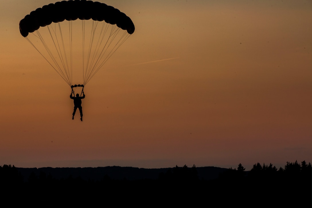 CAMP GRAYLING, Mich. – A U.S. Marine with Echo Company, 4th Reconnaissance Battalion, 4th Marine Division, Marine Forces Reserve executes High Altitude–High Opening techniques at Camp Grayling Joint Maneuver Training Center, Michigan on August 2, 2017 during Exercise Northern Strike 17. The high-altitude, high-opening parachute insertion method allows Marines to covertly insert themselves onto the battlefield to conduct reconnaissance, acting as the eyes and ears for the commander. Exercise Northern Strike is a National Guard Bureau-sponsored training exercise that unites service members from multiple branches, states and coalition countries to conduct combined ground and air combat operations. (U.S. Marine Corps photo by Lance Cpl. Imari J. Dubose/Released).