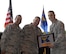 Outgoing LRS commander receives plaque for his service. U.S. Air National Guard Lt. Col. Brian R. Jusseaume, the outgoing 157th Logistic Readiness Squadron commander, receives a plaque for his service from Senior Master Sgts. Gil P. Fradillada, the 157th Maintenance Group materiel management flight superintendent, and Jeremy L. Mercier, the 157th Mission Support Group small air terminal superintendent, on August 5, 2017, at Pease Air National Guard Base, N.H.