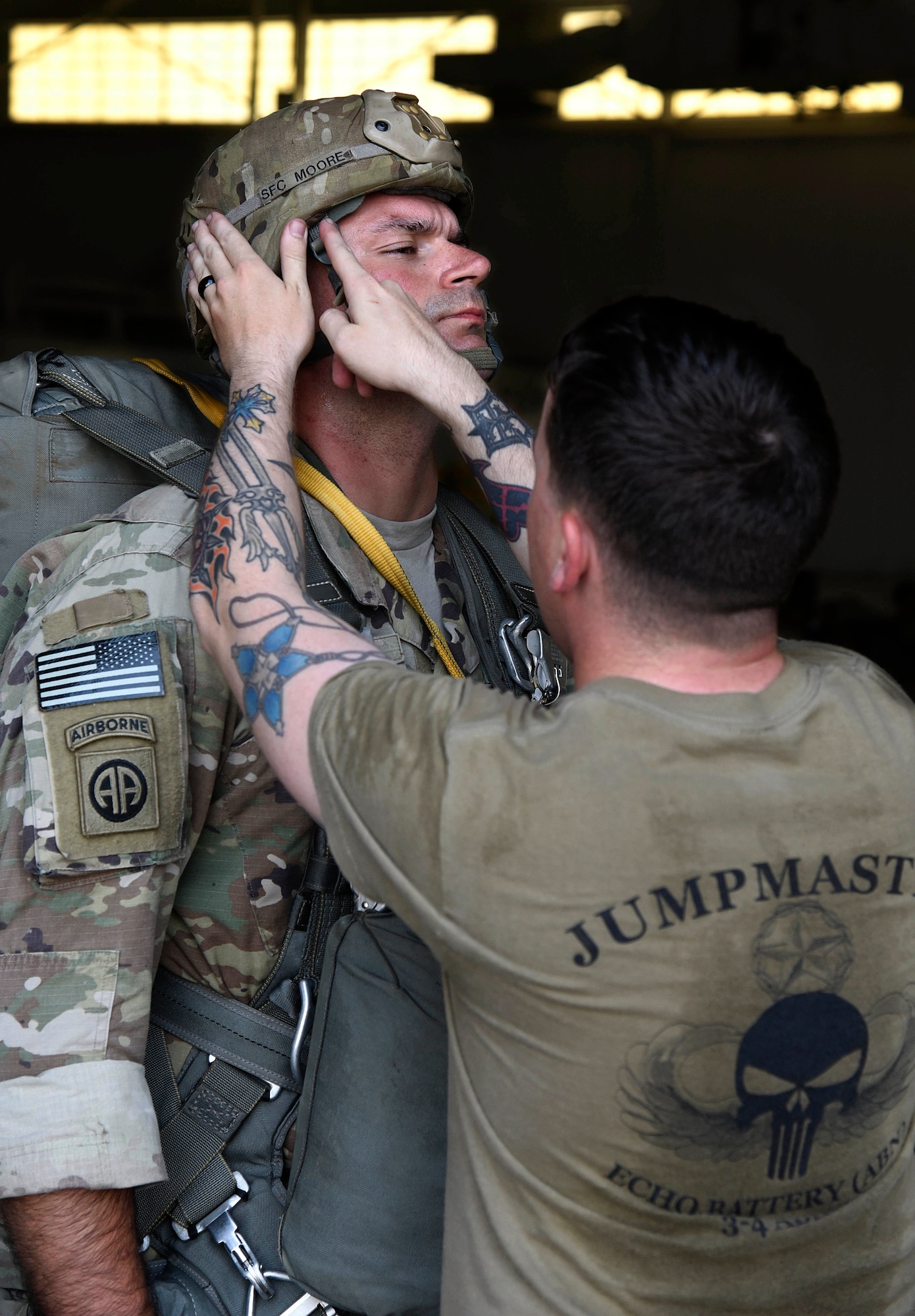 Soldier checking helmet before air drop