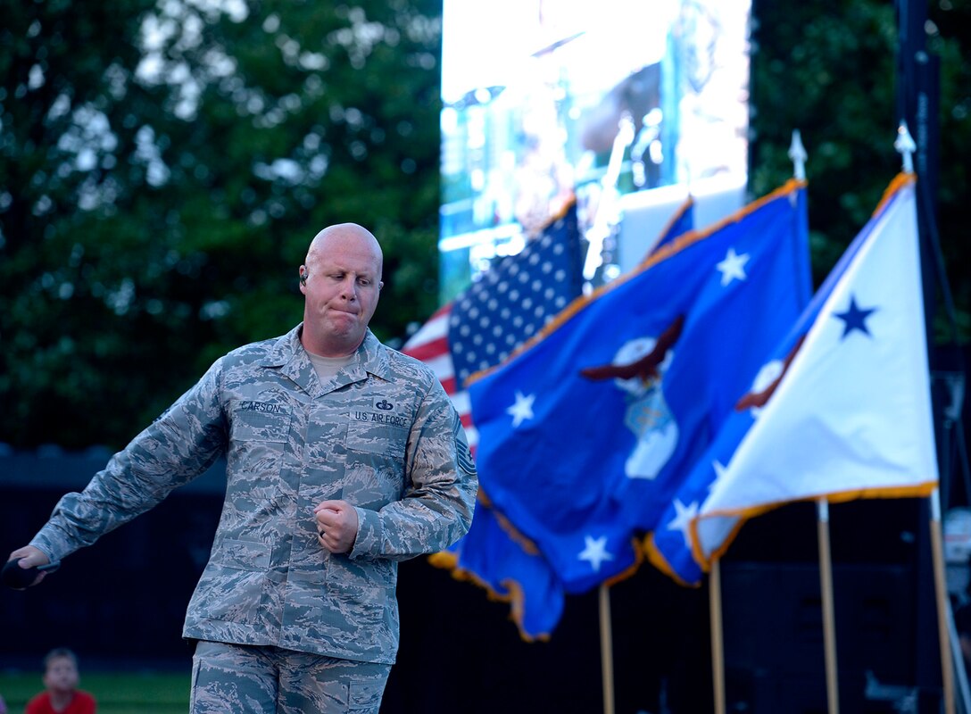 Air Force Bandsman Senior Master Sgt. Ryan Carson performs in honor of the Portraits in Courage Airmen during the final 2017 Heritage to Horizons summer concert series, in Arlington, Va., Aug. 4, 2017. (U.S Air Force photo/Senior Airman Rusty Frank)