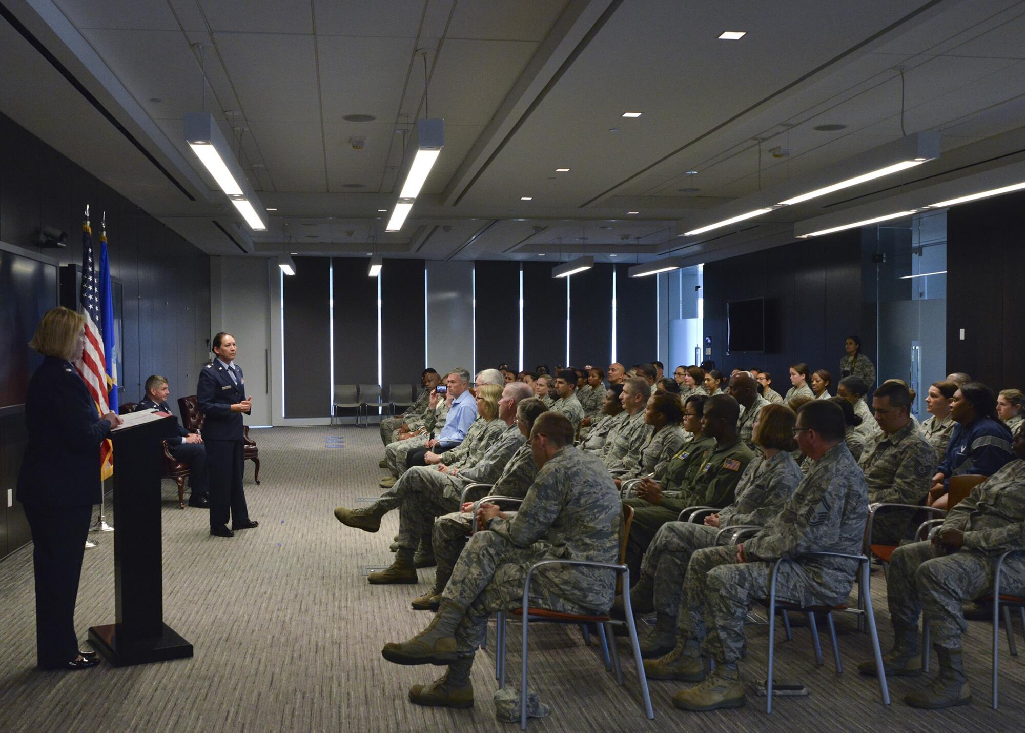 Col. Kimberly McCue addresses her new squadron after assuming command of the 459th Aeromedical Staging Squadron, Joint Base Andrews, Maryland on August 5, 2017. McCue will be responsible for the training and readiness of 140 medical personnel who ensure patients are medically and administratively prepared for flight. (U.S. Air Force photo/Tech. Sgt. Erica J. Knight)