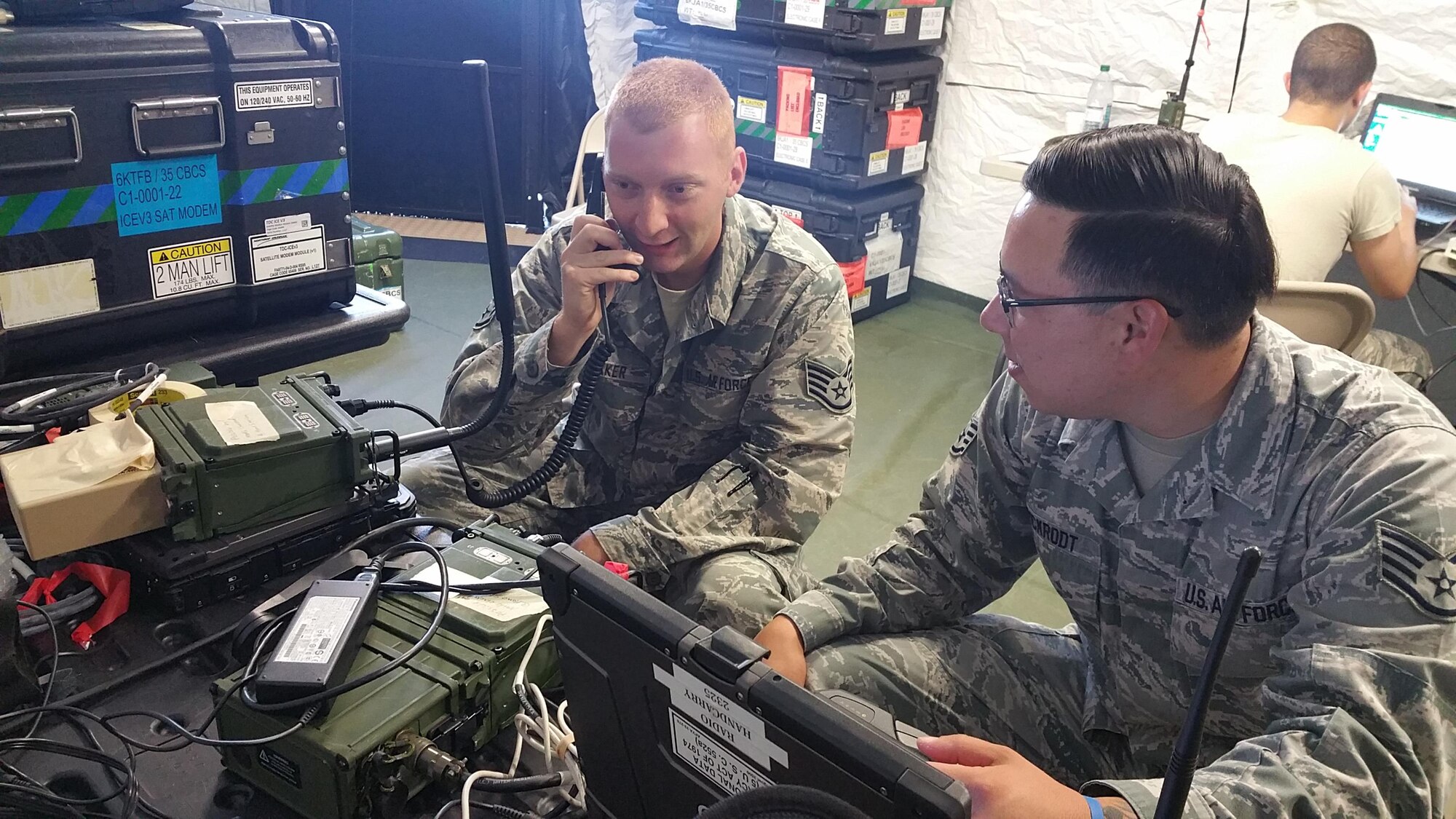 Staff Sgt. Bobby Speaker and Staff Sgt. Dean Pickrodt, bith radio frequency transmissions craftsmen assigned to the 35th Combat Communications Squadron test tactical radio advanced repeater network functionality in a simulated deployed environment during their annual tour at Homestead Air Reserve Base, Fla.